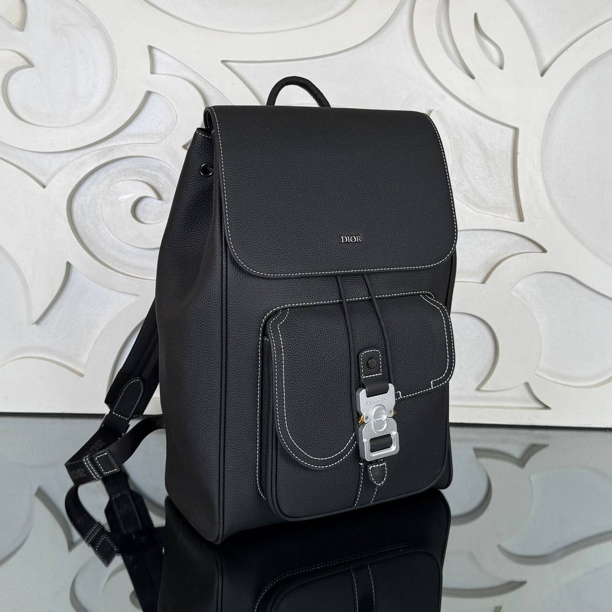 Saddle Backpack with Flap in Grained Calfskin | Black | angled view